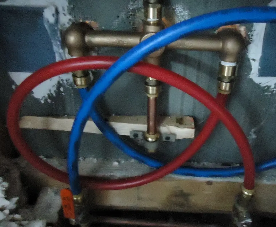 Plumber assembling and fitting water pipes